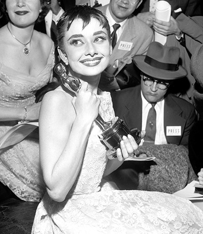 Audrey Hepburn, holds her Academy Award Oscar she earned for