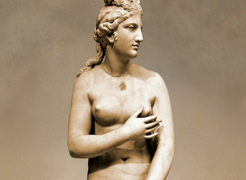 Greek Classical Period Statue of Aphrodite made of Parian marble. Restored by the famous Italian Sculptor A. Canova ( 1757 - 1822 ), Aphrodite is standing nude apart from a richly draped himation which she retains with her left hand in front of her pudenda. 4th c. BC. Athens National Archaeological Museum cat No 3524, from the collection of Lord Hope, donated by M. Embeirikos in 1924.