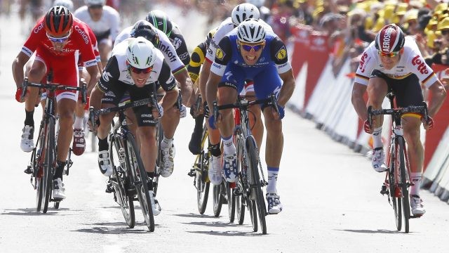Britain's sprinter Mark Cavendish, second left, crosses the finish line ahead Germany's Marcel Kittel, second right, and Germany's Andre Greipel, right, to win the first stage of the Tour de France cycling race over 188 kilometers (116.8 miles) with start in Mont-Saint-Michel and finish in Utah Beach, France, Saturday, July 2, 2016. (AP Photo/Peter Dejong)