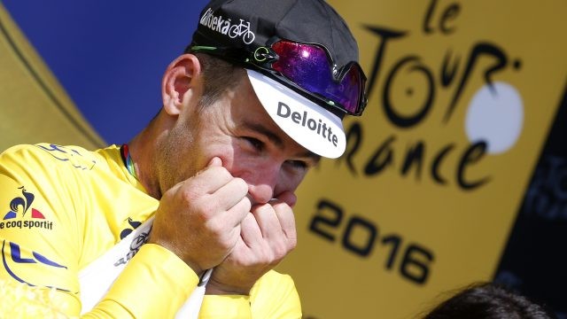 British Mark Cavendish of Dimension Data celebrates in the yellow jersey of leader in the overall ranking after the first stage of the 103rd edition of the Tour de France cycling race, 188km from Mont-Saint-Michel to Utah Beach Sainte-Marie-du-Mont, Saturday 02 July 2016, France. This year's Tour de France takes place from July 2nd to July 24rth. BELGA PHOTO POOL YUZURU SUNADA