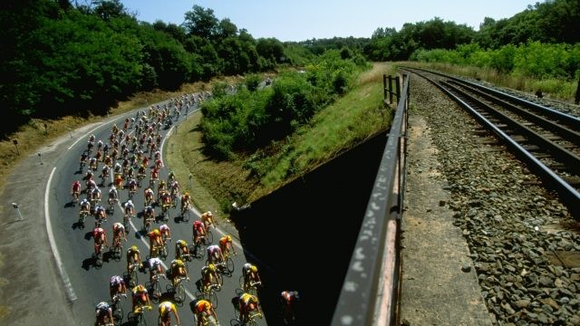 19 Jul 1998: The peloton passes under a railway bridge during Stage 8 of the Tour De France between Brive-la-Gaillarde and Montauban. Mandatory Credit: Graham Chadwick /Allsport